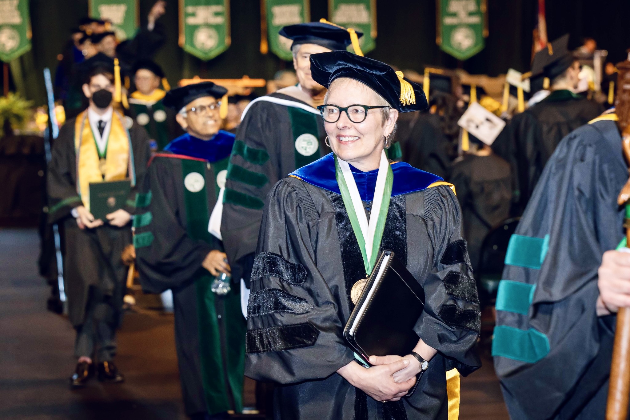 President Laura Bloomberg processing in Spring 2022 Commencement ceremony.